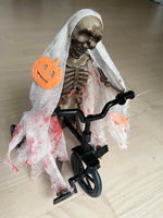 Halloween skelet på cykel