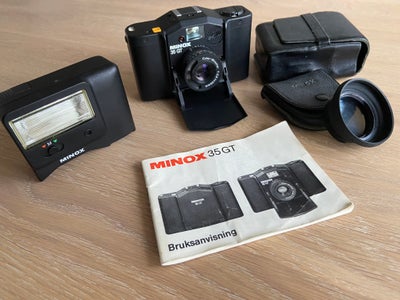 Minox, 35GT, Perfekt, Et lille velbygget 35 mm kompakt kamera der passer i skjortelommen. Bemærke, a