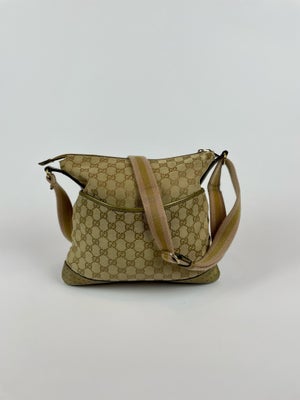 Crossbody, Gucci, kanvas, Beskrivelse

Denne Gucci crossbody taske er et unikt og stilfuldt tilbehør
