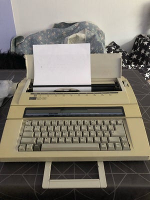 Skrivemaskine, Elektronisk skrivemaskine, Elektronisk skrivemaskine i mærket Nakajima.
Model: AX-65.