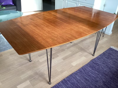Spisebord, b: 100 l: 170, Teak. Bordet er 100 cm på midten og 75 cm ved enderne. Incl.2 tilllgsplade