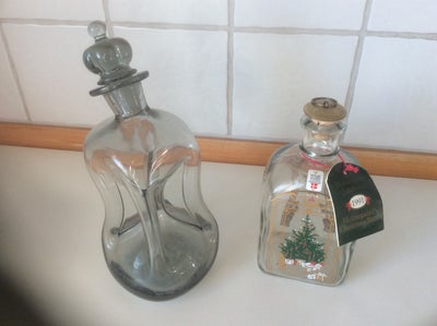 Glas, Klukflaske, Holmegaard, Røgfarvet skæv klukflaske
Julesnapse flaske 1991
Pris pr stk 200 kr
Sa