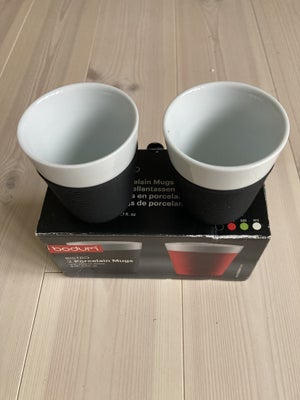 Porcelæn, Krus, Bodum Bistro, 2 stk. porcelænskrus med sort silikone bånd 0.17 l
I original emballag