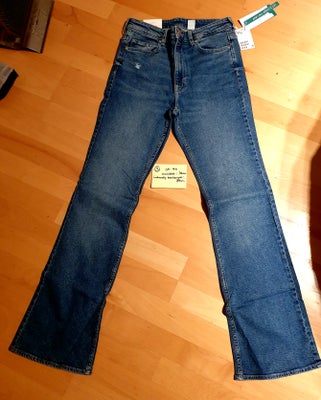 Jeans, H&M, str. 40,  Ubrugt, H&M  Jeans (NR 3)
Bootcut high waist
Helt nye stadig med tags på
Str 4