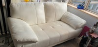 GRATIS
Sofa i hvidt kunstskind ( slidt )
