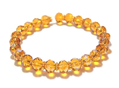 Armbånd, perler, Designer USA, Super smukt glas / krystal armbånd udarbejdet i gyldne topas facet kr