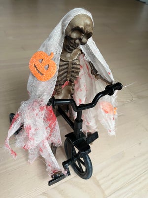 Halloween skelet på cykel, Halloween cykel med uhyggeligt skelet på.

Kan køre, sige uhyggelige lyde