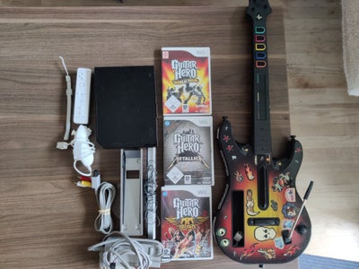 Nintendo Wii, Guitar Hero Wii Pakke, God, Alt virker som det skal og er klar til brug.

Ekstra guita