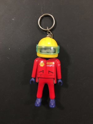 Nøgleringe, Playmobil, Playmobil-nøglering med rød racerkører og gul hjelm.
Nok købt omkring 2000.

