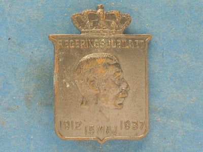 Emblemer, Christian d. X nål fra 1938, Regeringsjubilæet  15. maj 1937.

Kan sendes.