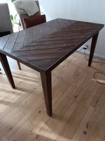 Dark brown dinning table for sale.the top is ha...