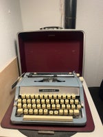 Brother skrivemaskine med rejsekuffert, trænger...