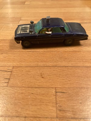 Biler, Corgi Toys - Oldsmobile, Bilen har en “knap” på taget, som ved tryk får personerne i bilen ti