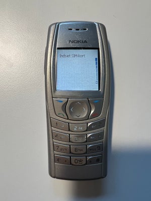 Nokia 6610i, God, 

Pæn slank sølvfarvet Nokia telefon 6610i.
Der følger batteri med, der kan lades 