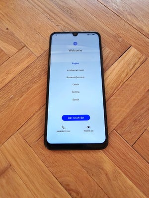 HUAWEI ukendt, Sælger den her mobiltelefon fra 2022. Den har en lille flænge øverst på skærmen, men 