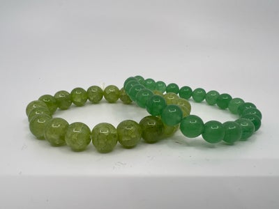 Armbånd, Helt enkelt elastik armbånd af flotte krakelerede glas perler.
(Perlerne er runde og ens i 