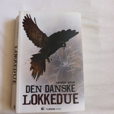 Den danske lokkedue, Henrik Brun, genre: krimi og spænding, Rimelig pæn hft. 1. udg. på 594 sider.