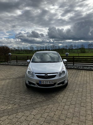 Opel Corsa, 1,2 16V Enjoy, Benzin, 2007, km 136000, sølvmetal, træk, airbag, 3-dørs, centrallås, sta