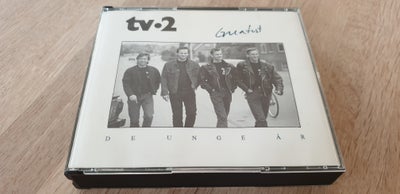 TV-2: Greatest - De Unge År, electronic, Box-set med 2 CD’er og sangbog (booklet).
/Rock/Pop/Pop Roc