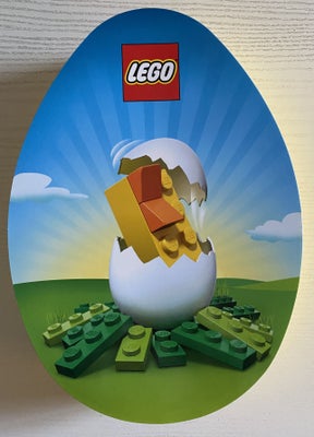 Lego andet, Påskeæg æske, Rigtig flot gul LEGO æske formet som et påskeæg.
På låget er et motiv med 