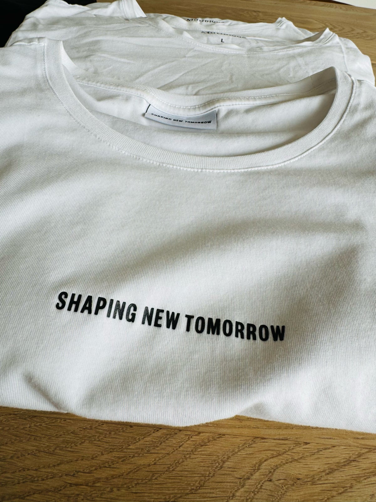 Andet, Shaping New Tomorrow , str. L