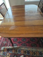 Spisebord med 1 tillægs plade.129 cm lang og 60...