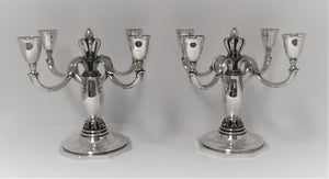 K. C. Hermann. Et par 4 armede sølv lysestager. Højde 21 cm.