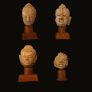 Fire Buddhahoveder udført i terracotta.  Sydøstasien 11-13 å